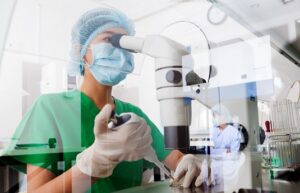 Asian scientist using microscope in the laboratory